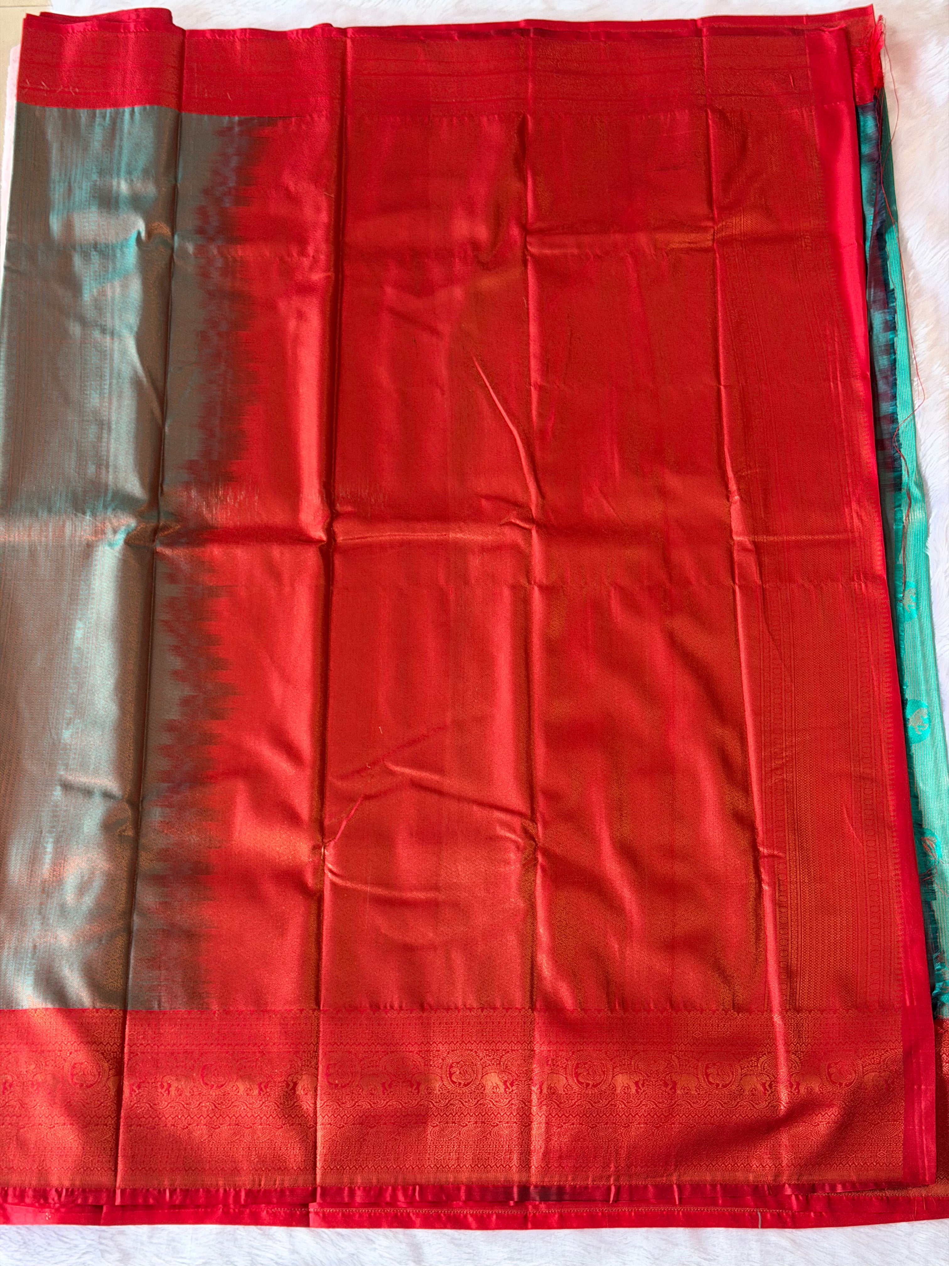 Deep red elephant motif border on seafoam green Kanchipuram polyester saree - South Indian heritage design