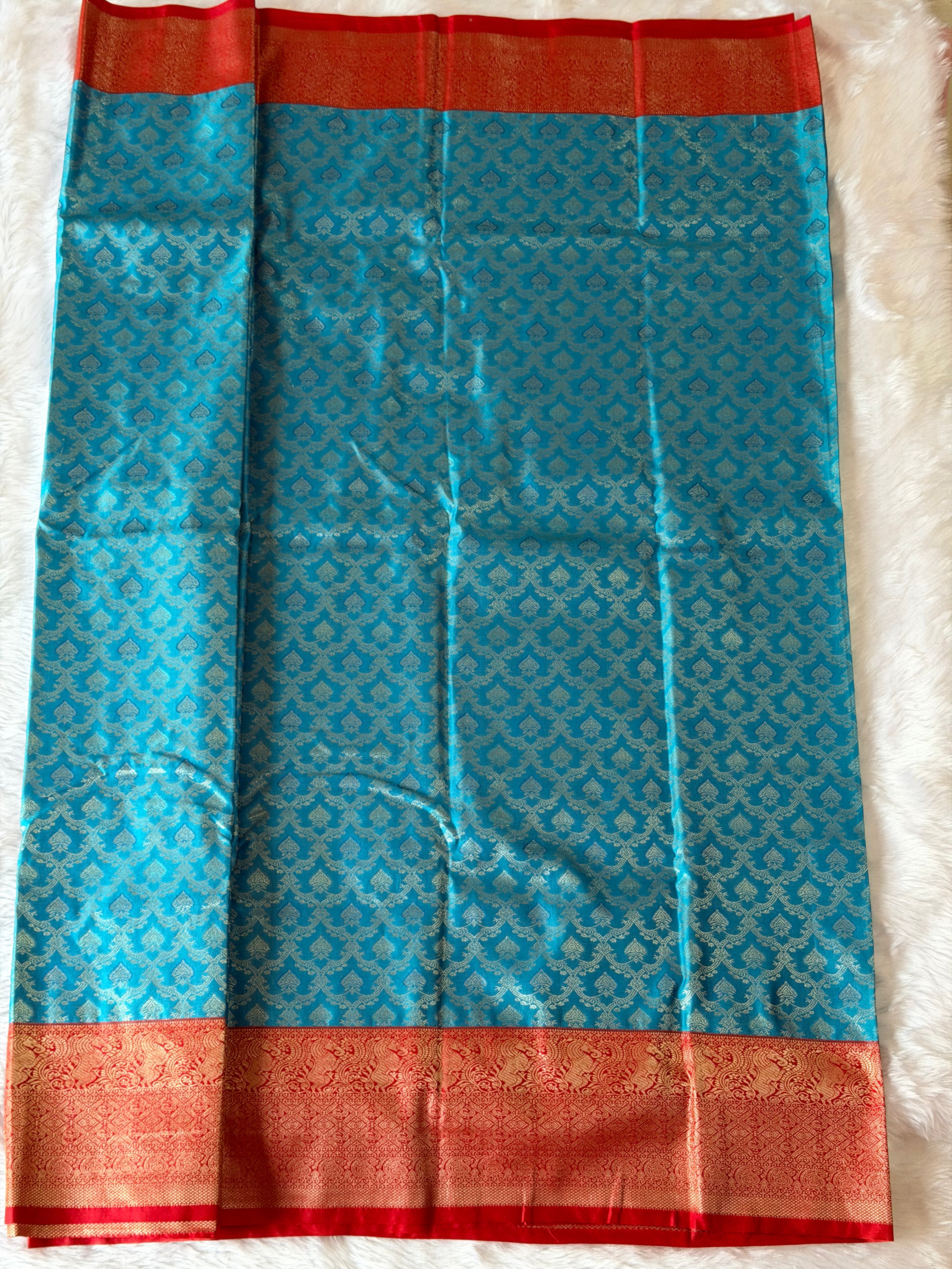 Teal blue Kanchipuram polyester saree body with all-over gold zari leaf motifs